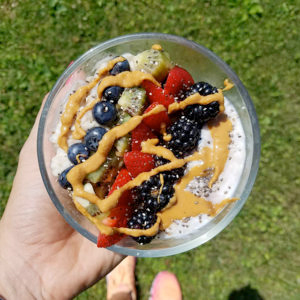 Oatmeal bowl topped with fruit and nut butter